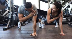 Fitness trainer demonstrating arm toning exercises Arundel