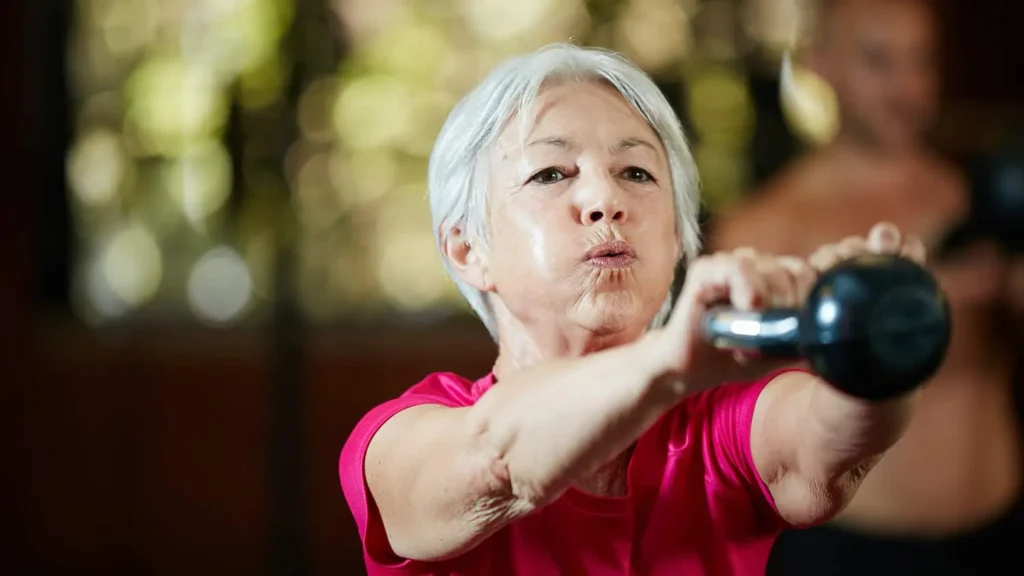 Person performing arm exercises with dumbbells Arundel