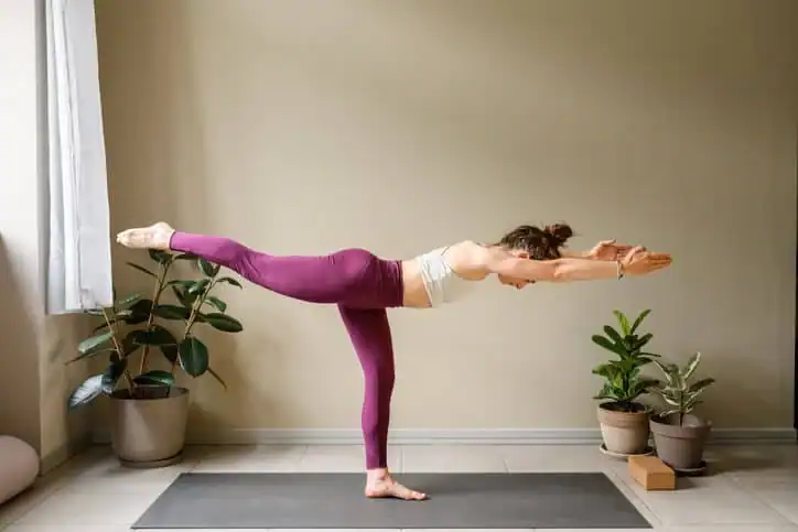 Woman doing Yoga exercise Arundel to help with toning the body. 