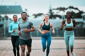 image of people running to incorporate cardio Arundel exercise into their life to help tone arms and body.
